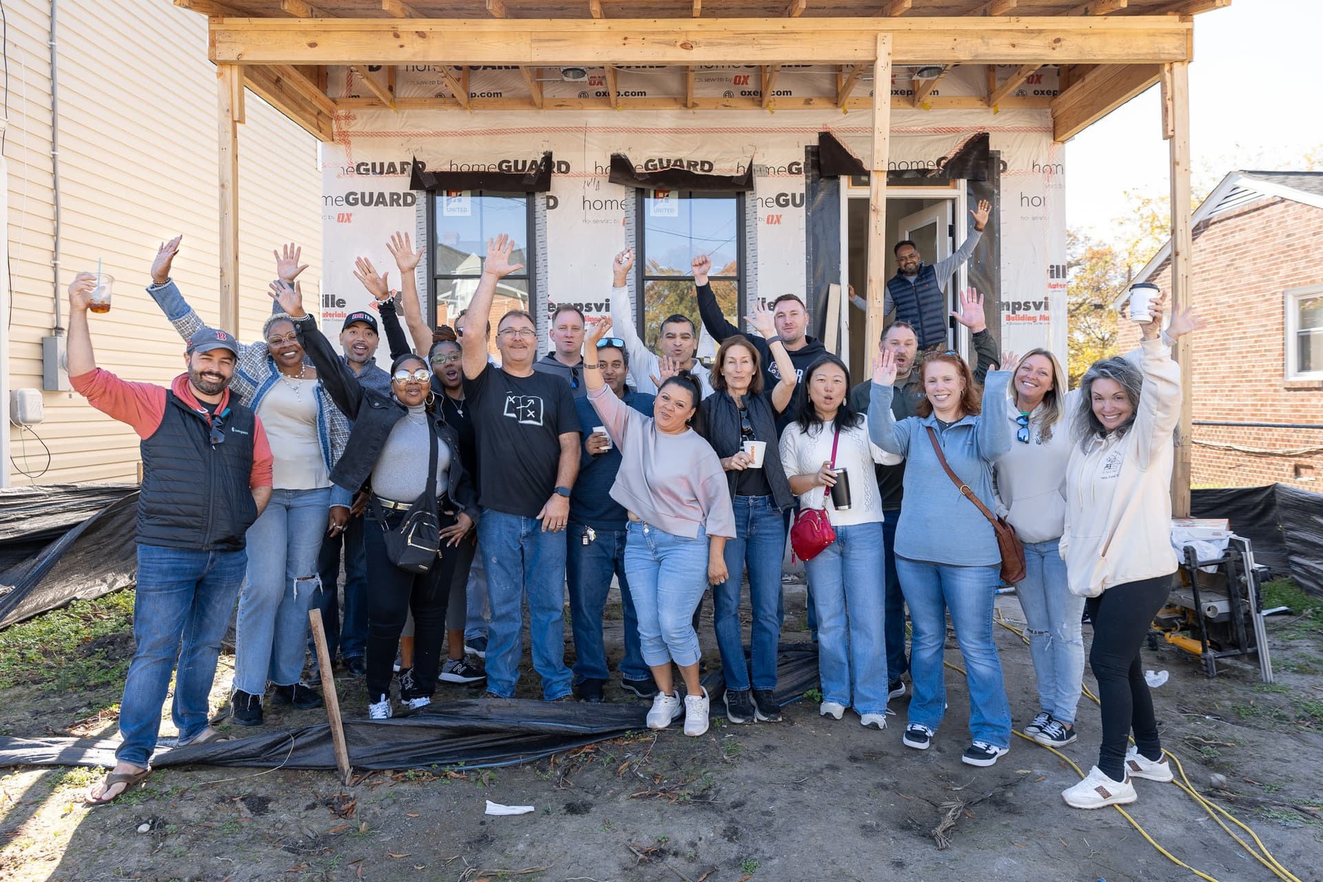 The team celebrating at a new build project